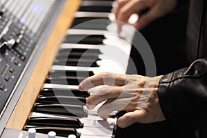 Rock musician playing on a keyboard instrument