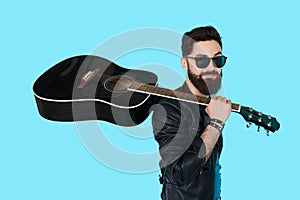 Rock musician posing with guitar