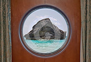 Rock in Ocean through Porthole