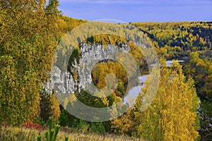 A rock outcrop of the gypsum mountain Podkamennaya overhangs the Sylva River in the Kungur region