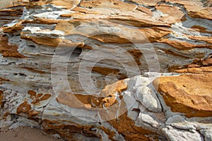A rock outcrop with interesting patterns and colors
