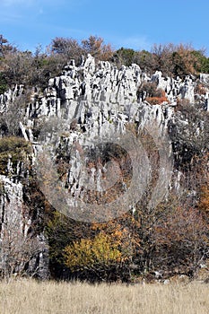 Rock outcroppings in autumn, sunny day photo