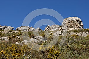 View from hiking trail of rock outcrops on the ridge of the Cavall Verd, Alicante Province, Spain photo