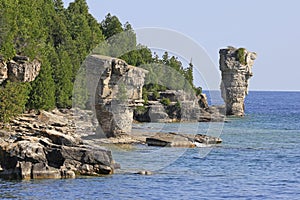Rock pillars rise from the waters of Georgian Bay on Flowerpot island in Fathom Five National Marine Park, Lake Huron