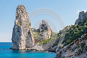 Rock pinnacle called `Pedra Longa` in the Orosei gulf near Santa Maria Navarrese, small sea village in Ogliastra Sardinia, Italy