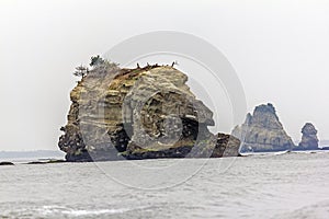 Rock protruding from the sea, Japan photo