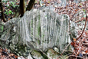 Rock with rills in the mountains photo