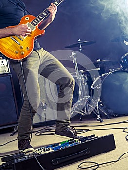 Rock and roll guitar player on stage