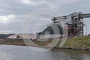 Rock salt processing plant with piles of salt