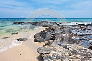 Rock, sand, sea and sky