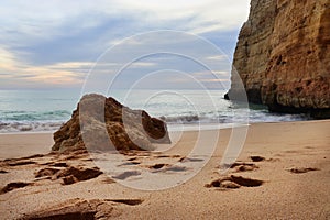 Rock on a sandy Portuguese beach