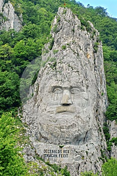 The Stone Statue of Decebalus, king of the Dacians, at the Iron Gates, on Danube River - landmark attraction in Romania photo
