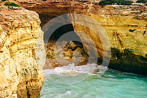.Rock by the sea. the concept of harmony, energy of life and meditation. benagil in portugal, cliffs on the famous beach , waves c