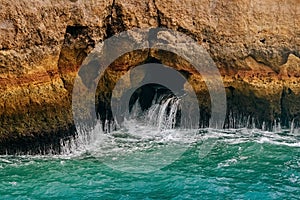 .Rock by the sea. the concept of harmony, energy of life and meditation. benagil in portugal, cliffs on the famous beach , waves c