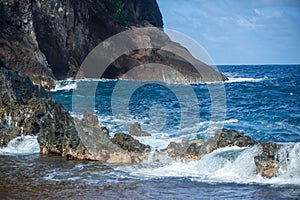 Rock and sea. View of turuoise water and lava rocks beach, atlantic ocean waves. Topical travelling background. Tenerife