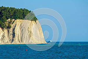 Rock in the sea by which the ship sails