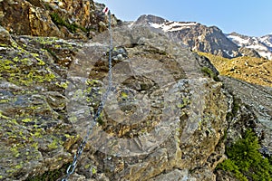 Rock section secured with a steel cable on the way to the BietschhornhÃ¼tte