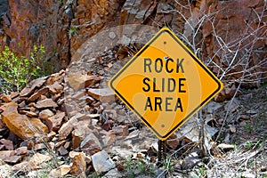 Rock Slide Area Sign with Fallen Rocks