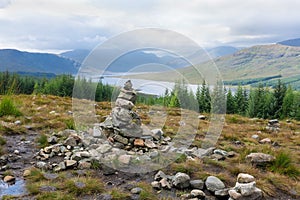 Rock stack in front of Loch Loyne in Scotland