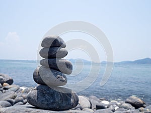 Rock stacked, stones stack on the coast of the Sea in the nature. Life balance, spa stones treatment scene concept. Stones on Hin