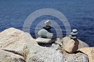 Rock stacks by blue sea