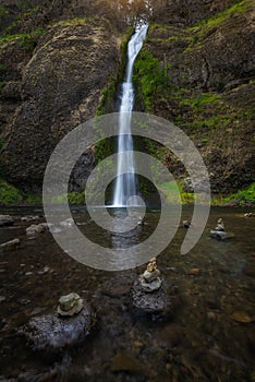 Rock stacks in front of Horsetail Falls in Oregon