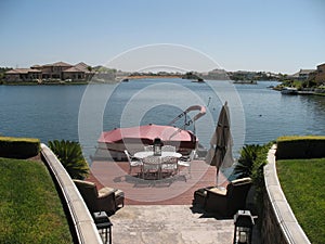 Rock Staircase Leading to Redwood Patio and Pontoon Boat