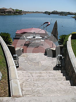 Rock Staircase, Redwood Patio Deck with Pontoon Boat on Lake