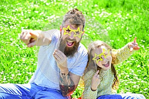 Rock star concept. Family spend leisure outdoors. Child and dad posing with star shaped eyeglases photo booth attribute photo