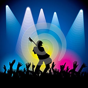 Rock star performing with guitar on abstract background