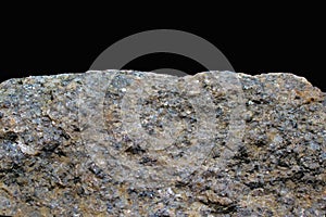 Rock or stone on black background. Granite crouan rim or pick edge like cliff or mountain. Geology mineral texture isolated closeu