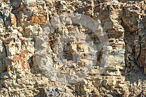 Rock stone side background. White clay rock carrier mountains closeup. For indicate the layers of soil and rock