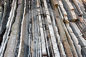 Rock strata, geological texture background detail in Zumaia, Basque Country, Spain.