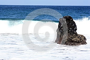 Rock in the surf Playa de Bollullo, Canary Islands, Spain
