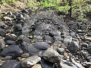 rock texture of a small river when the water recedes in a village in Indonesia 7 photo