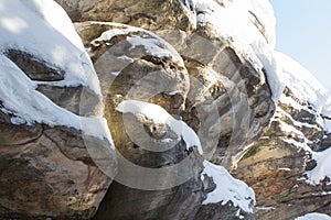 Stone texture in snow and ice. Mountain wall. Rock texture.