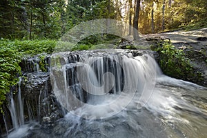 Rock thresholds on the Tanew River create picturesque small waterfalls