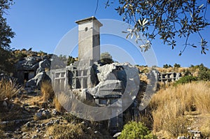 Rock tombs ruins at necropolis of Xanthos Ancient Lycia City, Turkey. Old Lycian civilization heritage photo