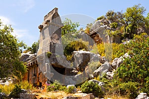 Rock tombs, tombstones and sarcophagi on a mountainside near ancient city of Sura. Turkey