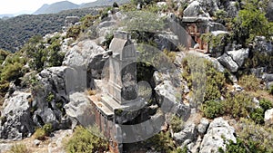 Rock tombs, tombstones and sarcophagi on a mountainside near the ancient city of Sura. Turkey