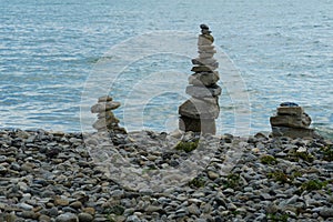 Rock towers built from boulders situate on shore of the lake Constance, Bodensee.