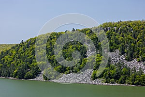 A Rock and Tree Covered Hill At Devils Lake