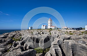 Rock view background with the Lighthouse of Cape Carvoeiro, Peniche, Portugal.