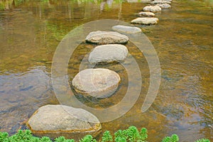 Rock walkway lines patterns in river background