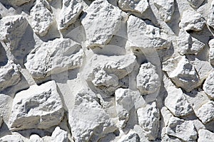 Rock Wall Background. Rock and Pebble Wall Background. Small Rough Shaped Rocks