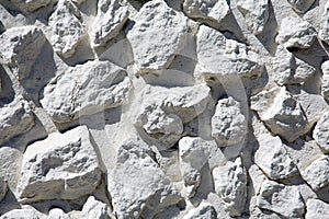 Rock Wall Background. Rock and Pebble Wall Background. Small Rough Shaped Rocks