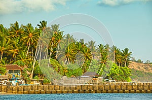 Rock Wall protecting Candidasa Town on the Coast of Bali, Indone photo