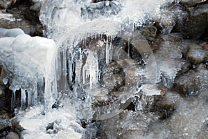 Rock water cascade or frozen waterfall on mountain stream