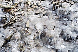 Rock water cascade or frozen waterfall on mountain stream