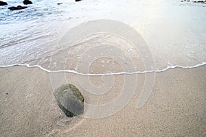 Rock and wave on the Ao Sen beach Phuket